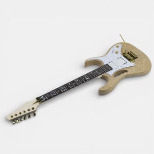 Complete Jem Ibanez guitar assembled showing natural ashwood electric guitar Ibanez body with a white pickguard and gold hardware. The guitar has a ebony fretboard with white floral inlays. Jem Ibanez guitar kit supplied by The Guitar Fabrik