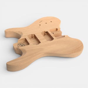 rear side of guitar body for headless guitar kit with pick ups cravity and tremolo cravity pre-dilled, neck with fretboard and black nut installed by The Guitar Fabrik