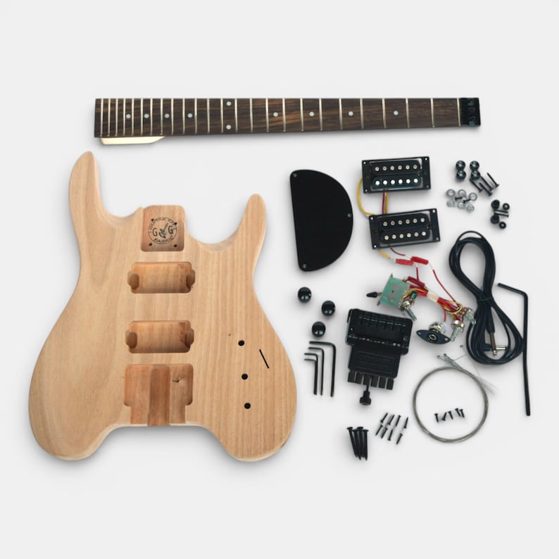 overview of complete guiar kit headless Steinberger style showing solid mohogany body, maple neck with rosewood fretboard, hardware set in black with solderless electronic parts to build your headless guitar by The Guitar Fabrik