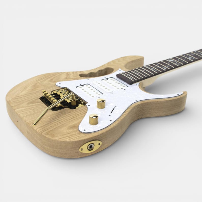 guitar kit and body of Ibanez Jem guitar intergrated and guitar parts installed including: tuner, volume, tremolo, jack and pearl pickguard to build your own guitar Ibanez Jem by The Guitar Fabrik