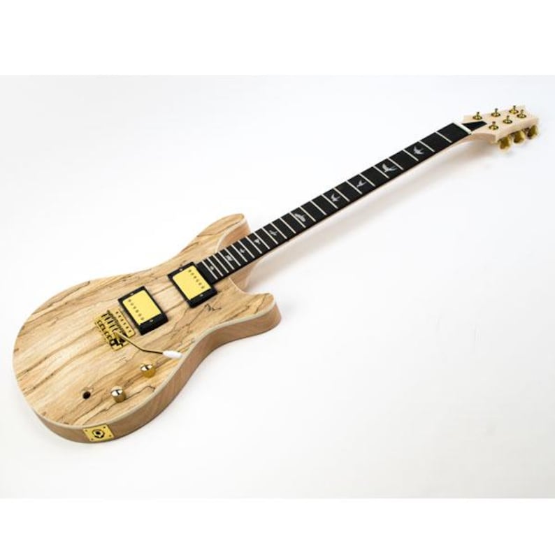 May include: A natural wood electric guitar with a black fretboard and gold hardware. The guitar has a unique wood grain pattern and a single pickup.