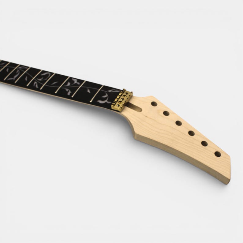 A natural maple wood electric guitar neck with ebony fretboard and white floral inlay. The neck has gold tuning keys and a white headstock of Jem electric guitar.