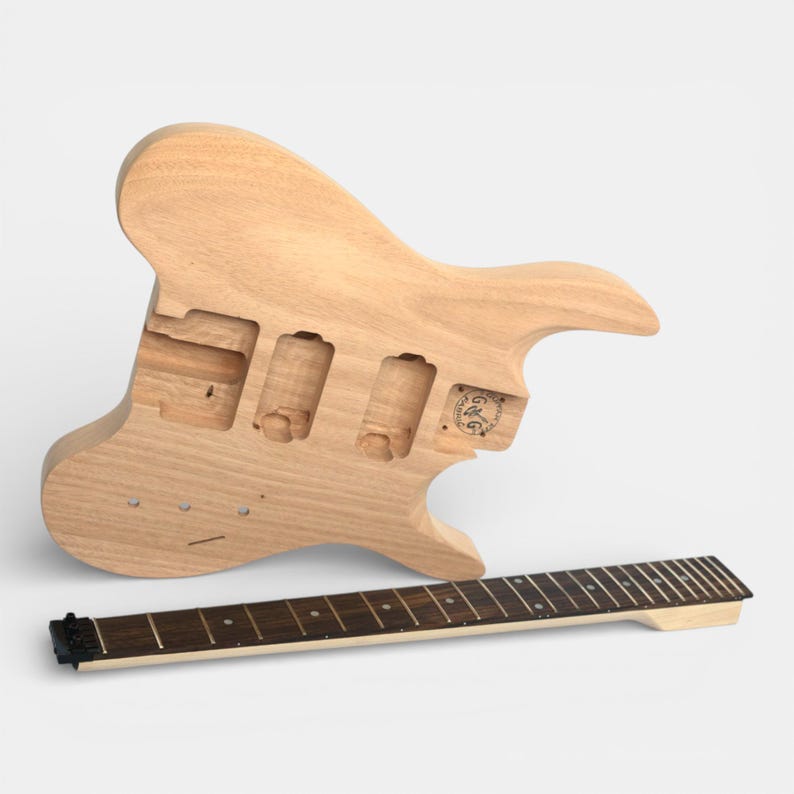 front view of guitar body and guitar neck of headless guitar kit with pick ups cravity and tremolo cravity pre-dilled, neck with fretboard and black nut installed by The Guitar Fabrik