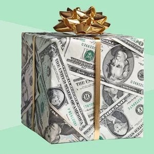 May include: A gift box wrapped in US dollar bills with a gold bow on top.