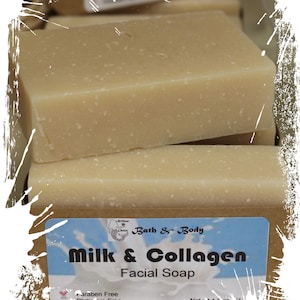 May include: Two bars of light brown soap with a white label that reads "Bath & Body Milk & Collagen Facial Soap Paraben Free Phthalate Free Net wt. 4.8 oz."
