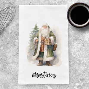 May include: A watercolor illustration of Santa Claus holding a gift, wearing a green coat with white fur trim, and standing next to a green Christmas tree. The text "Martinez" is printed below the image.