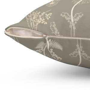 a close-up view of a pillow with a floral pattern on it.