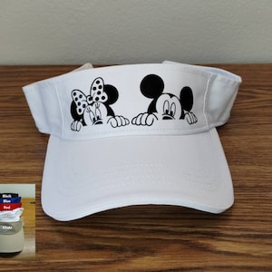 May include: White visor with a black and white image of Mickey Mouse and Minnie Mouse peeking over the top. The visor is available in other colors.