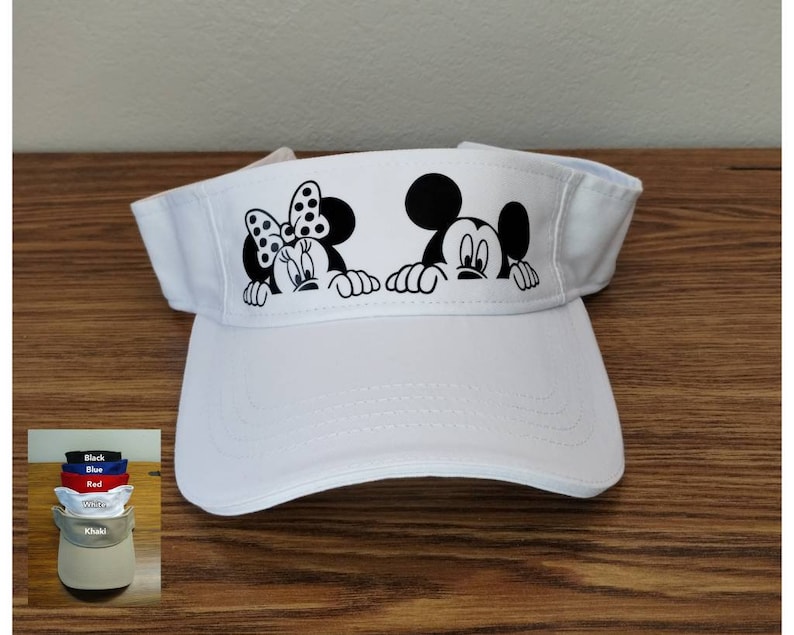 May include: White visor with a black and white image of Mickey Mouse and Minnie Mouse peeking over the top. The visor is available in other colors.