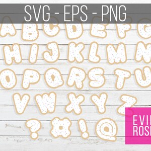 May include: A set of cookie-shaped alphabet letters and symbols with white frosting and colorful sprinkles. The letters are A through Z, and the symbols are a question mark, a hashtag, an exclamation point, and an at symbol. The letters and symbols are on a white wood background.