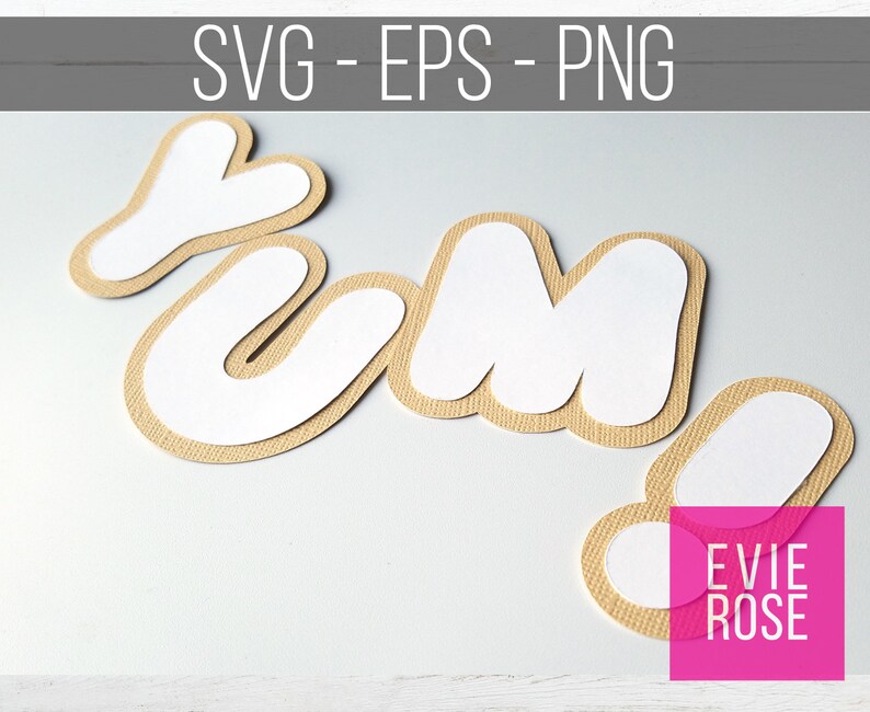 May include: A set of four brown paper letters spelling "Yum!" with white paper backing. The letters are in a playful, rounded font. The letters are on a white background.
