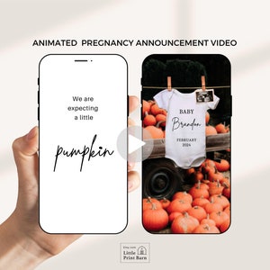 May include: Animated video announcement of a pregnancy with a pumpkin theme. The video shows a phone screen with the text "We are expecting a little pumpkin" and then transitions to a phone screen showing a white onesie with the text "Baby Brandon February 2024" hanging on a clothesline in front of a pile of pumpkins.