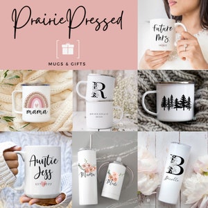 May include: A collection of personalized mugs and tumblers with various designs, including a rainbow with the word "mama", a floral design with the word "mama", a tree design, a letter "R" with the word "bridesmaid", a letter "B" with the word "Buelle", and the words "Auntie Jess EST 2022".