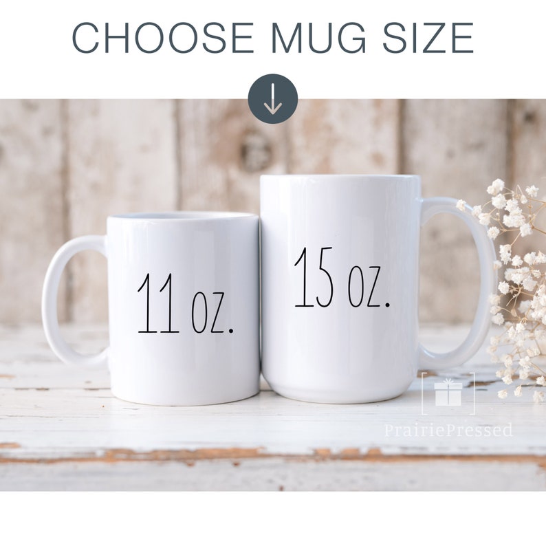 May include: Two white ceramic mugs with black text. The smaller mug is 11 oz and the larger mug is 15 oz.