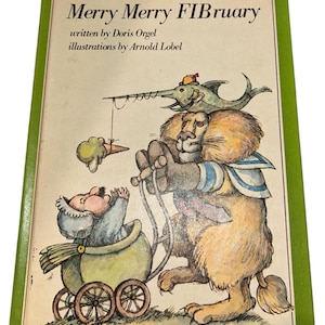 May include: A vintage children's book titled "Merry Merry FIBruary" with illustrations by Arnold Lobel. The cover features a lion pulling a baby carriage with a baby inside, and a fish with a hat fishing for ice cream.