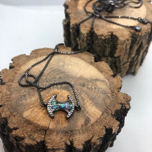 axe charm bolo necklace