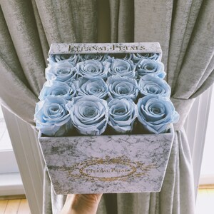Luxury Light Blue Roses in an Ultimate LuxuryBox with a Gold Logo