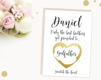 May include: A white card with gold lettering that says "Daniel Only the best brothers get promoted to..." with a gold heart that says "Godfather" and the text "Scratch the heart" at the bottom.