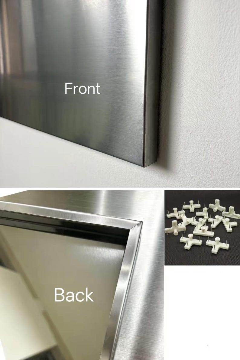 Puede incluir: Un panel met&aacute;lico rectangular con acabado cepillado, etiquetado como Front y Back en las im&aacute;genes. La vista trasera muestra un borde de marco empotrado. Se incluye un grupo separado de peque&ntilde;os colgadores de pared de pl&aacute;stico blanco con pines.