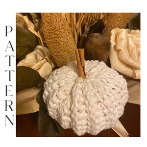 Close-up of handmade crochet pumpkin showing the textured crochet stitches and pumpkin shape