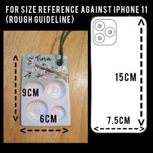 May include: A rectangular, hand-painted ceramic palette with four wells, a green cord, and the name "Tina". The palette is 9 cm tall and 6 cm wide. The image includes the text "FOR SIZE REFERENCE AGAINST IPHONE 11 (ROUGH GUIDELINE)".