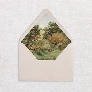 May include: A light pink envelope with a window showing a watercolour painting of a woodland scene with green trees and a path leading into the woods.