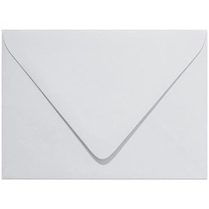 May include: A white envelope with a pointed flap.