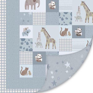 May include: A baby quilt featuring a patchwork design with various animal illustrations. The quilt showcases giraffes, pandas, koalas, and elephants in soft, muted colors. The border has a light blue and white checkered pattern.