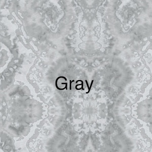 May include: A close-up of a grey, textured surface with a white, stylised word "Gray" printed on it.