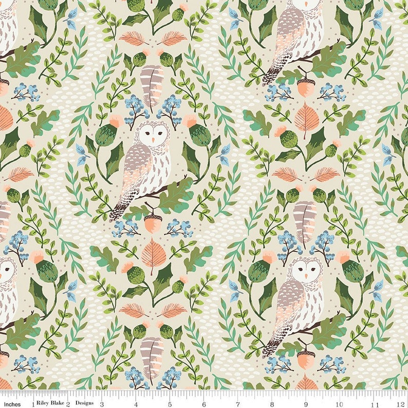 May include: A beige fabric with a repeating pattern of owls, leaves, acorns, and berries. The owls are white with brown and gray markings. The leaves are green and orange. The acorns are brown. The berries are blue.
