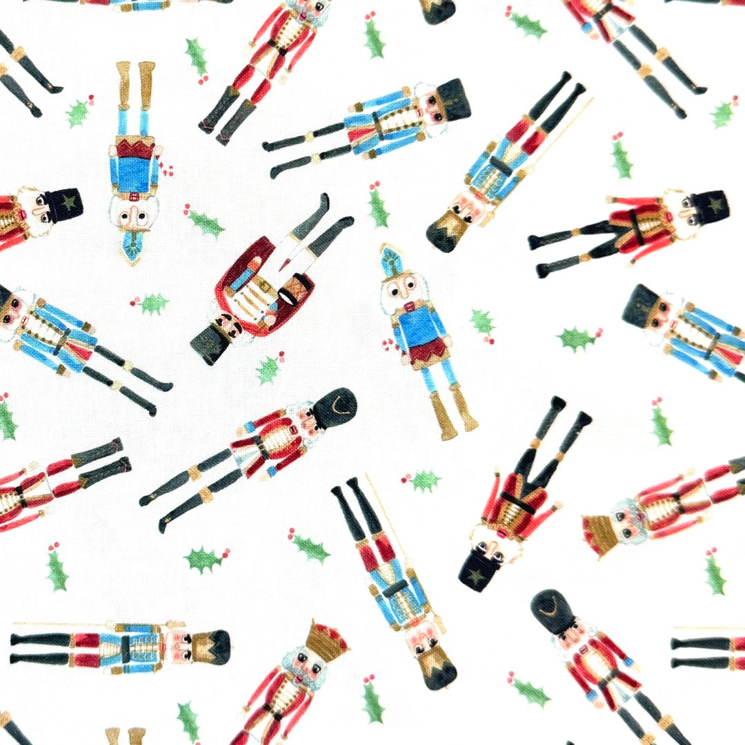 The Nutcracker Suite 2 Scattered Nutcrackers on White Fabric by the