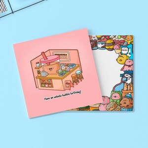 May include: A pink greeting card with a cartoon illustration of a bubble tea shop and the text "Have an unbelie-bubble birthday!". The card on the right has a border of cartoon food characters.