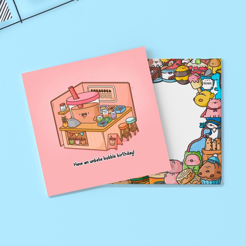 May include: A pink greeting card with a cartoon illustration of a bubble tea shop and the text "Have an unbelie-bubble birthday!". The card on the right has a border of cartoon food characters.