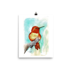 May include: Watercolour painting of a hummingbird perched on a branch. The hummingbird is orange and yellow with a long, thin beak. The background is a soft blue and green.