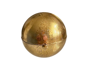 Polvera vintage con forma de globo de Pigmalión, circa 1950