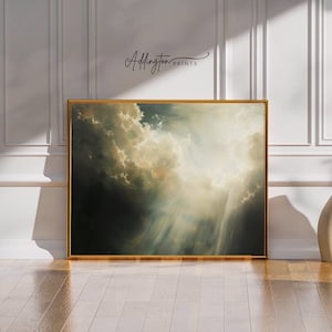 Pode incluir: Uma impressão de arte emoldurada com uma dramática paisagem de nuvens com raios de luz. A obra de arte tem uma moldura dourada e o texto "Addington Prints" no canto superior direito. A paleta de cores inclui tons de cinza, branco e dourado.