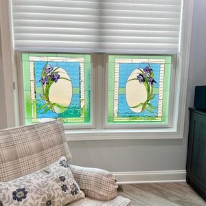 May include: Two stained glass windows with a floral design featuring purple irises in a blue and green frame.