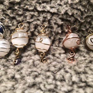 Yormuhjesty’s Round Selenite Pendant