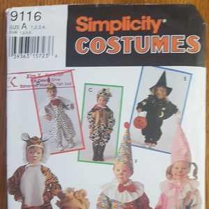 May include: Simplicity Costumes sewing pattern number 9116 for children's Halloween costumes. The pattern includes five different costumes: a tiger, a lion, a clown, a witch, and a dalmatian. The pattern is for sizes 1, 2, 3, and 4.