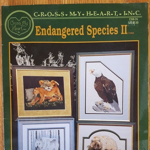 Counted Cross Stitch Endangered Species II  CBS-74  -  Harp Seal, Sea Otter, Lioness and Cub, Grizzly, Grey Wolf. Whooping Crane, Bald Eagle