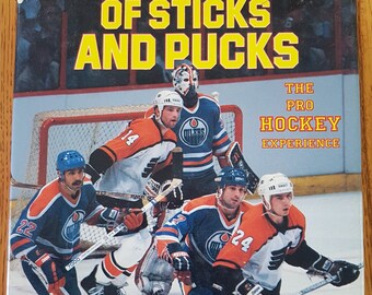 Des bâtons et des rondelles : l’expérience du hockey professionnel 1985 -- par Howard Berger & Bruce Bennett