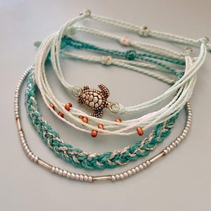 Summer Style Set Beach Bracelet Collection Ocean Theme Design Adjustable String Pattern Turquoise Multi Strand Details Glass Bead Accent Turtle Charm Feature Perfect Vacation Essential Beautiful Fashion Wear Coastal Collection