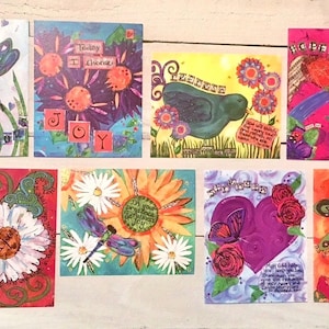 May include: Set of 10 colorful inspirational cards with various floral and nature designs. Each card features a different quote or verse. The cards are perfect for adding a touch of inspiration to your home or office.