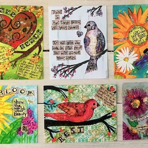 May include: Nine colorful cards with inspirational messages and artwork. The cards feature birds, flowers, hearts, and crosses. The messages include "Believe", "Brave Heart", "Trust in the Lord", "Bloom", "Rest", "Nothing is impossible with God", "Find your strength in the Lord", and "Bloom".