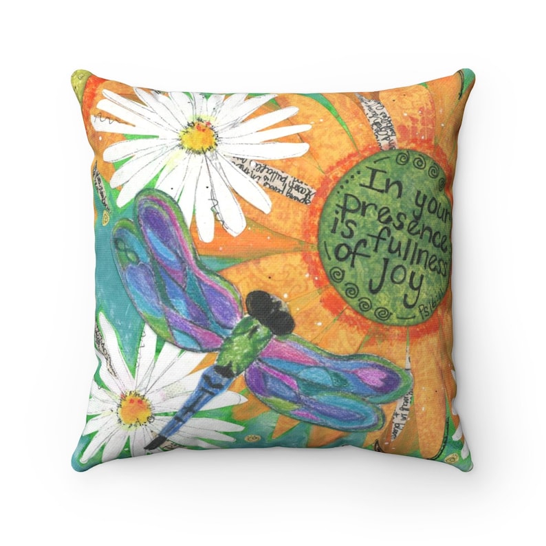 May include: A colorful throw pillow with a dragonfly, flowers, and the text "In your presence is fullness of joy - Psalm 16:11".