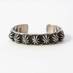 Sterling silver stamped cuff.  Artist: Myron Etsitty
