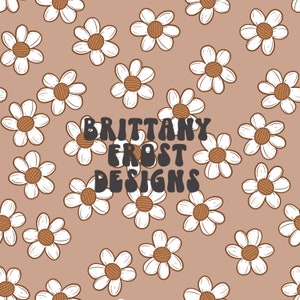 May include: A seamless pattern featuring white daisies with brown centres on a light brown background. The text "Brittany Frost Designs" is centred in the middle of the pattern.
