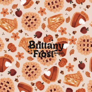 May include: A repeating pattern featuring illustrations of pumpkin pie slices, whole pies, pumpkins, apples, flowers, and acorns in shades of orange, brown, and cream. The text "Brittany Frost designs" is in the center.