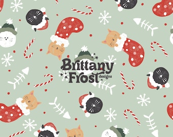 May include: A seamless pattern featuring a light green background with red and white candy canes, white snowflakes, and black and white cats wearing Santa hats. The cats are in red and white stockings with white polka dots. The pattern also includes a white fishbone and the text "Brittany Frost designs".