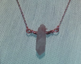 Gently grounding strawberry quartz point and copper necklace